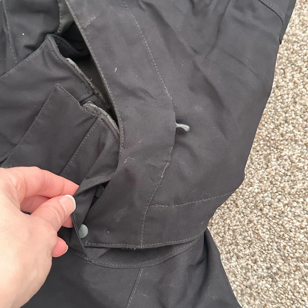 The North Face Black Hooded Raincoat with Multiple Front Pockets